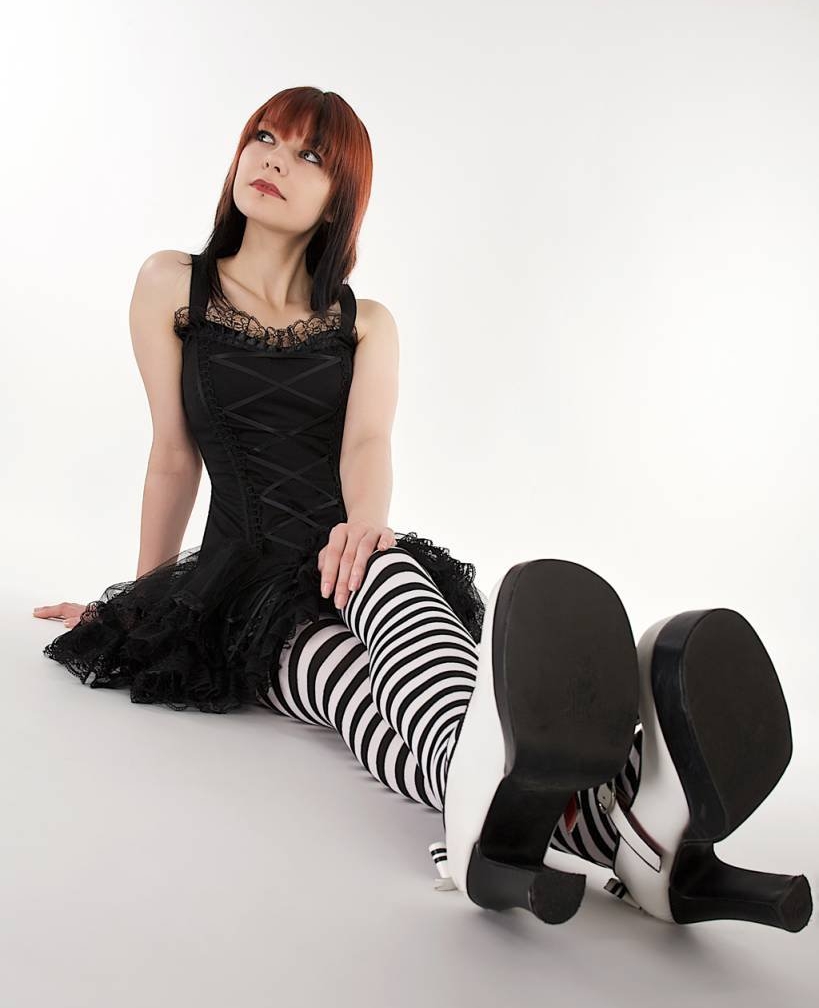 Redhead Gothic Girl wearing Black and White Opaque Pantyhose and Black Short Dress
